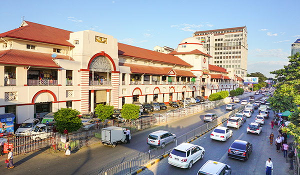 Yangon, Myanmar - Jan 14, 2015. The Sule Boulevard with famous Bogyoke Market built in 1926 and formely know as Scott Market. Sule Boulevard are the busiest street in Yangon.; Shutterstock ID 285905090; Your name (First / Last): Laura Crawford; GL account no.: 65050; Netsuite department name: Online Editorial; Full Product or Project name including edition: Yangon images for city app POIs